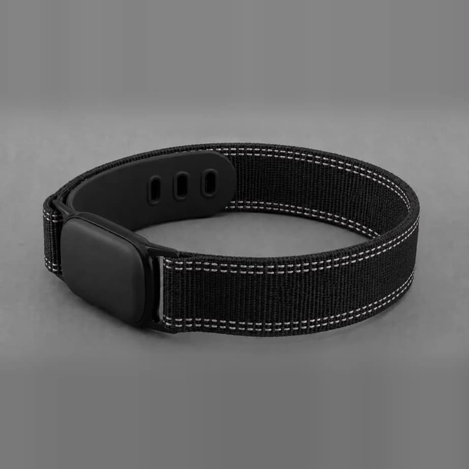 Aurevo pod seated in its black woven wrist band with reflective stitching